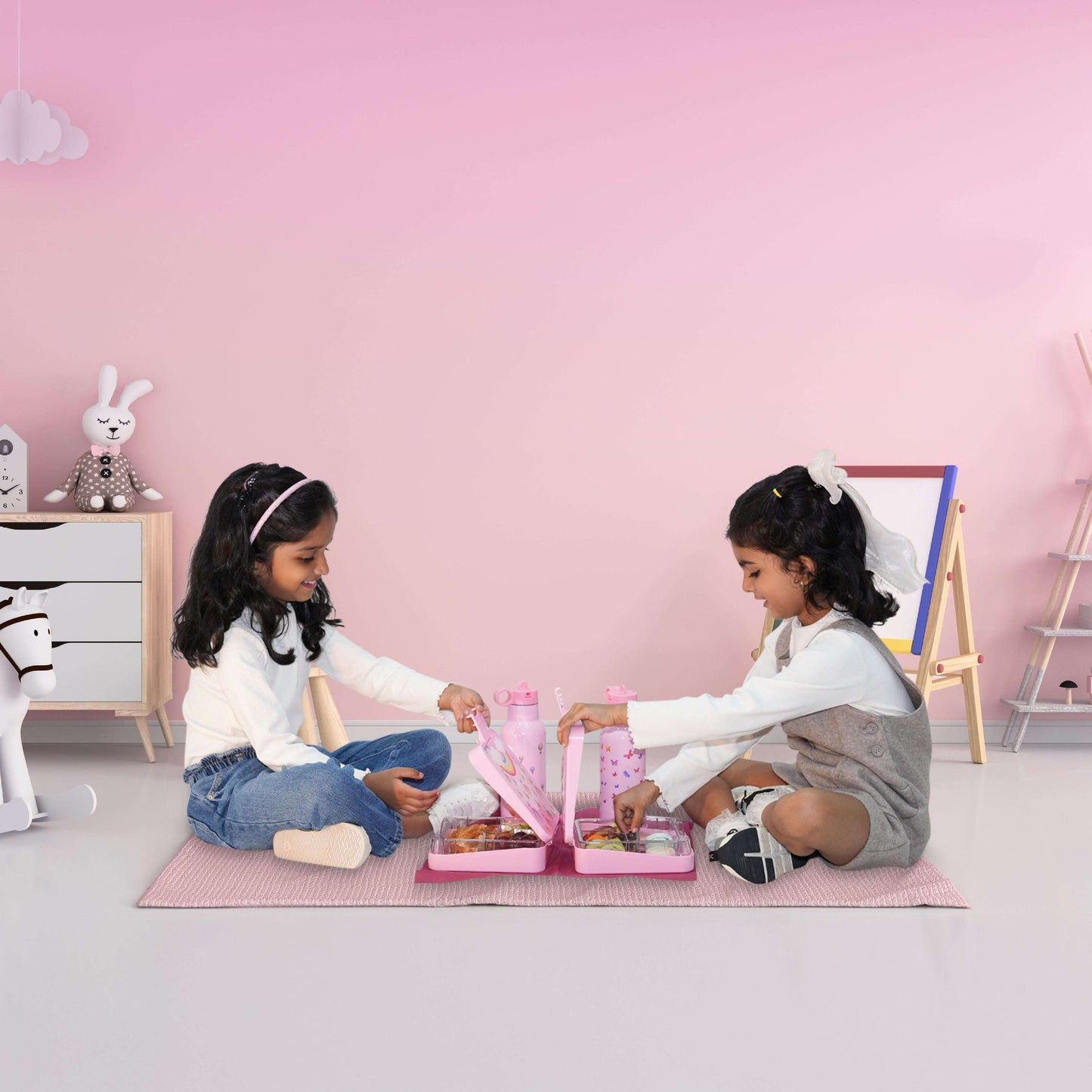Girls using Butterfly Magic Bentotss lunch box and sipper combo in play setting fun mealtime scene