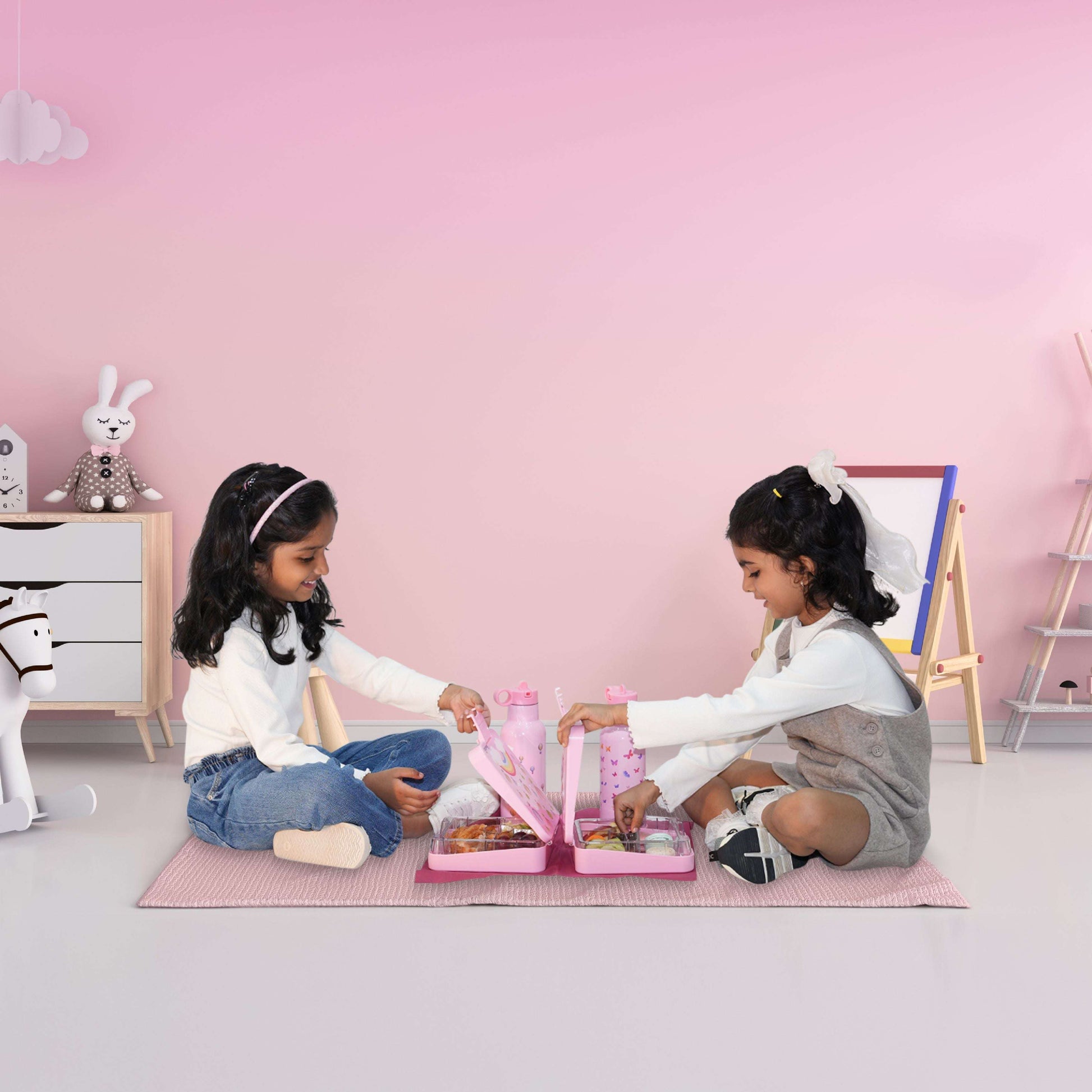 Girls using Butterfly Magic Bentotss lunch box and sipper combo in play setting fun mealtime scene
